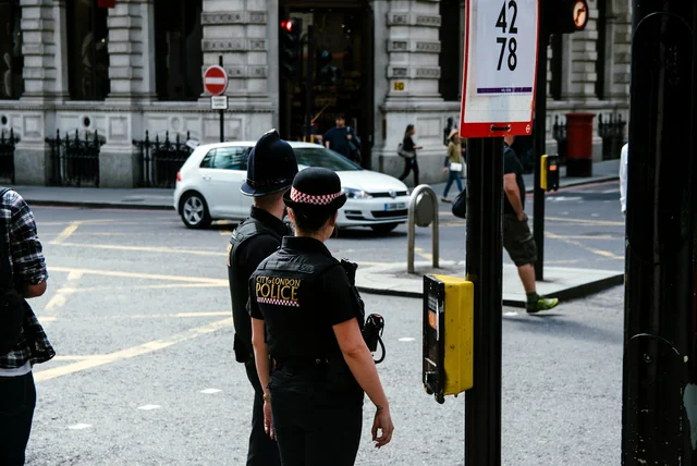 City of London Police officers on a London street, the force that runs Report Fraud