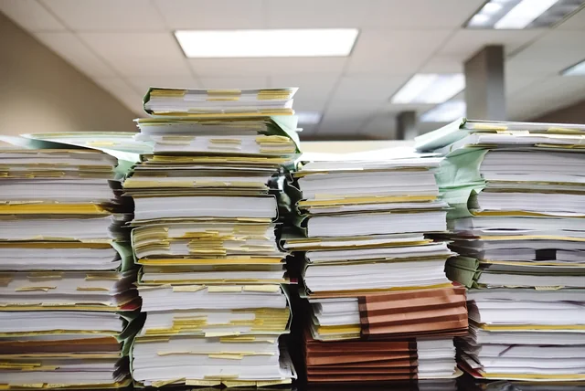 case files and paperwork, where a crime reference number earns its keep