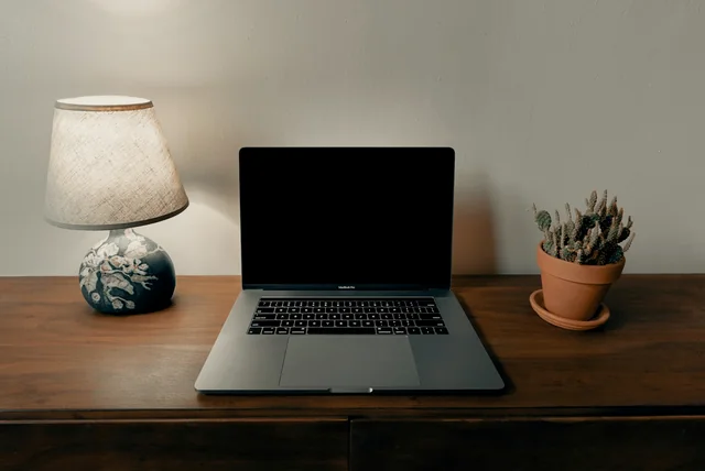 laptop on a home desk ready for changing passwords after a scam link