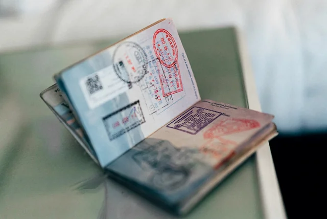 An open passport on a table, the photo ID used for full NHS login verification