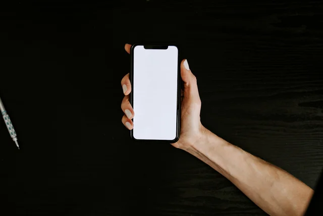 nhs app vs nhs login - person holding a smartphone ready to sign in to a health app