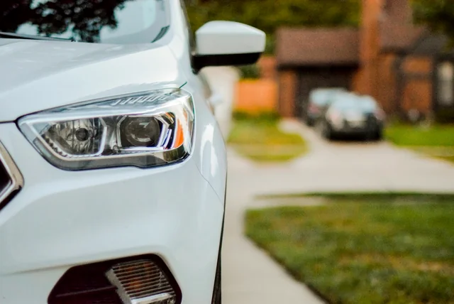 a used car on a driveway like those behind purchase scam deposits