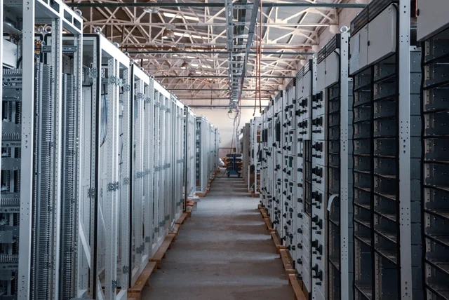 server racks representing hosting companies taking scam websites offline after NCSC reports
