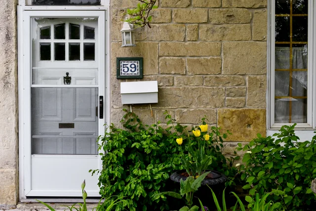 royal mail text scam – a front door and letterbox where genuine Fee to Pay cards arrive