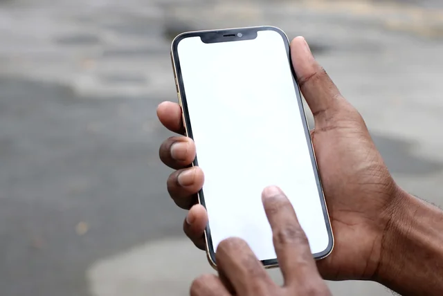 uk digital id shown on a smartphone held in a hand outdoors