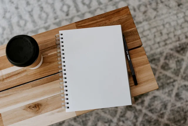 a notebook ready to record a crime reference number after reporting a hi mum scam