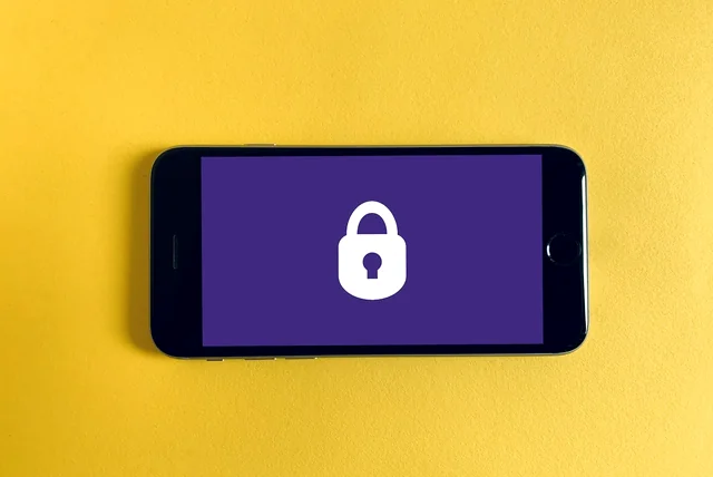 a padlock on a phone screen representing WhatsApp two-step verification against the hi mum scam